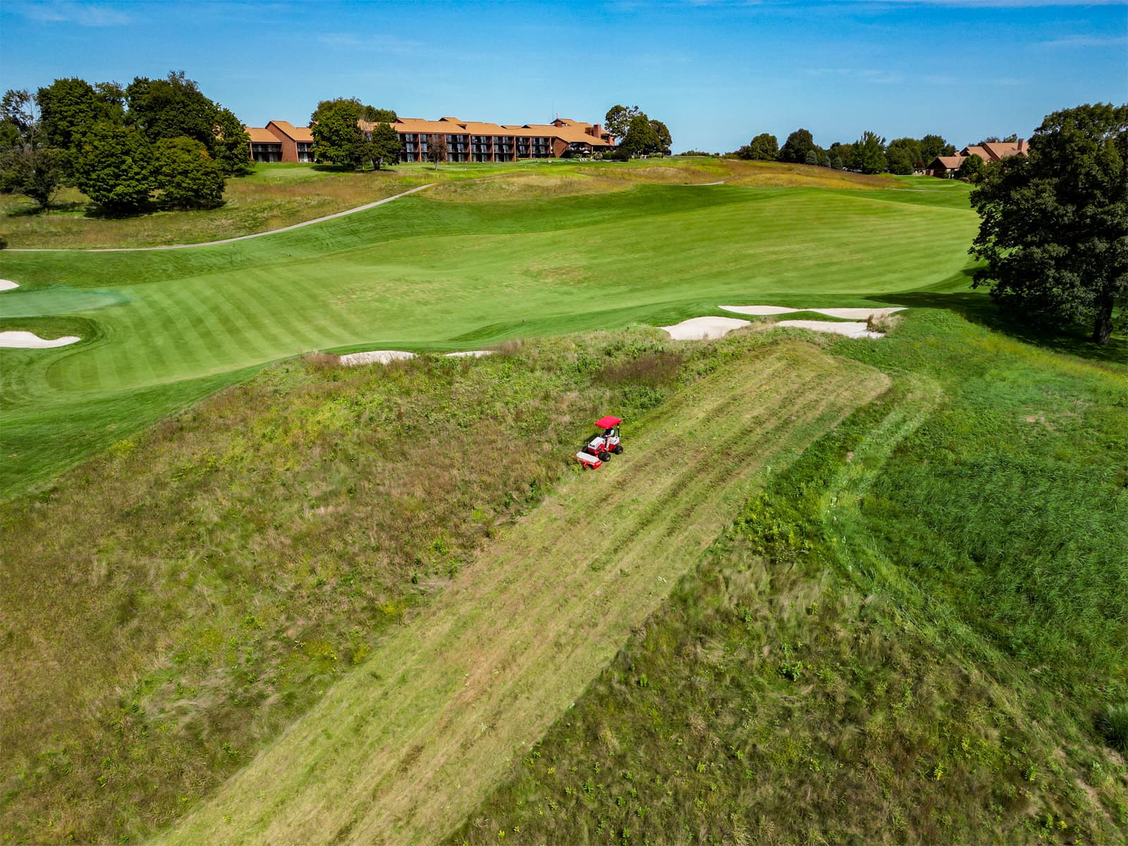 Aerial view of Ventrac field mowing